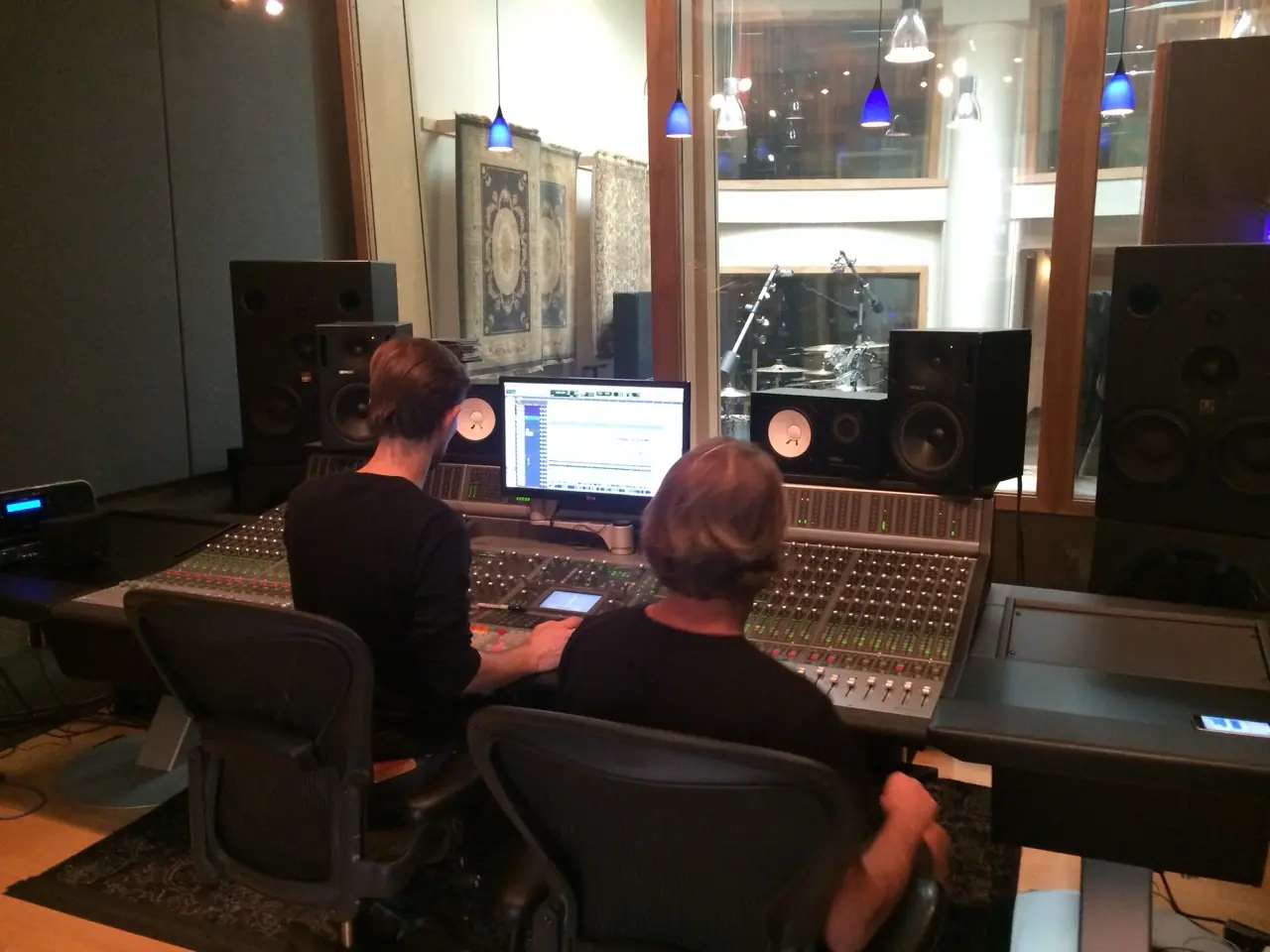 Two people at a large mixing console in the control room at Sonikwire Studios, during the Black Line sessions with Christian Eigner