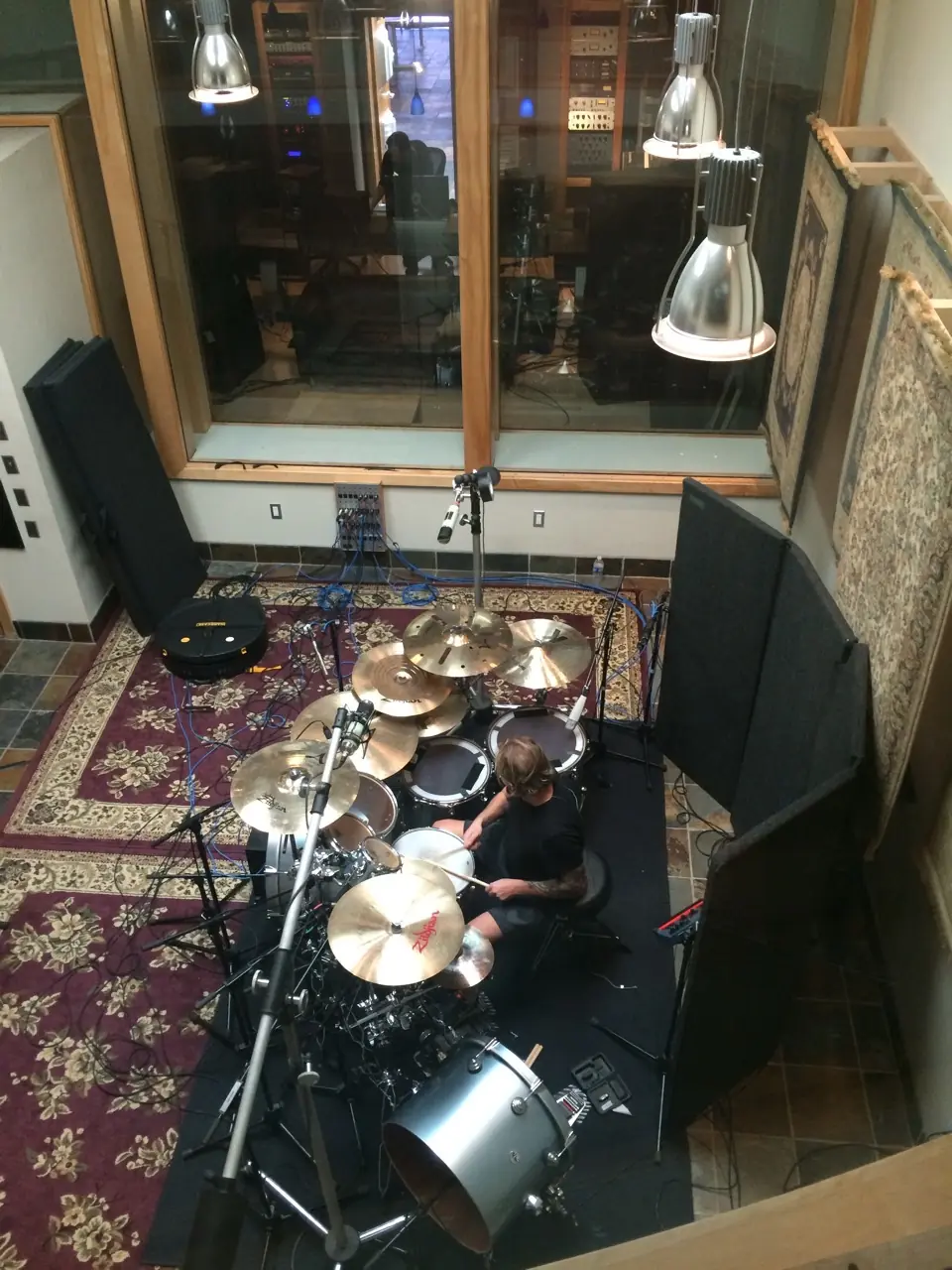 Christian Eigner at the drum kit, seen from above, in the drum room at Sonikwire Studios