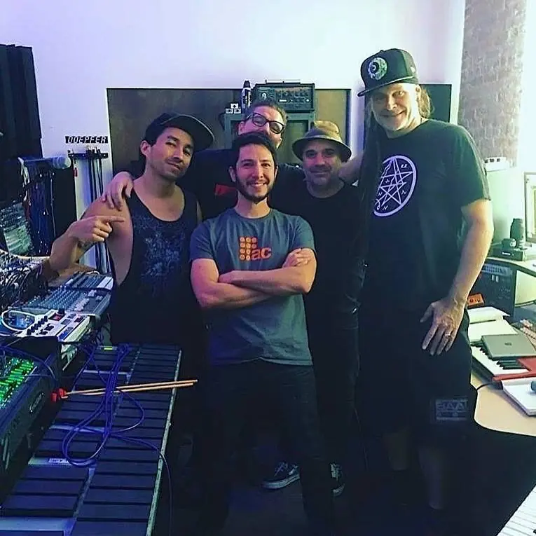 Baseck, Cyrus, Douglas J. McCarthy, Bon Harris and cEvin Key posing together in a studio
