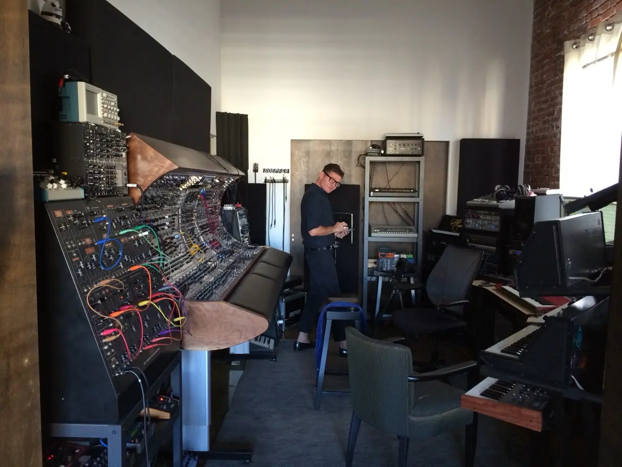 Wide view of the Los Angeles studio: modular console, racks and keyboards