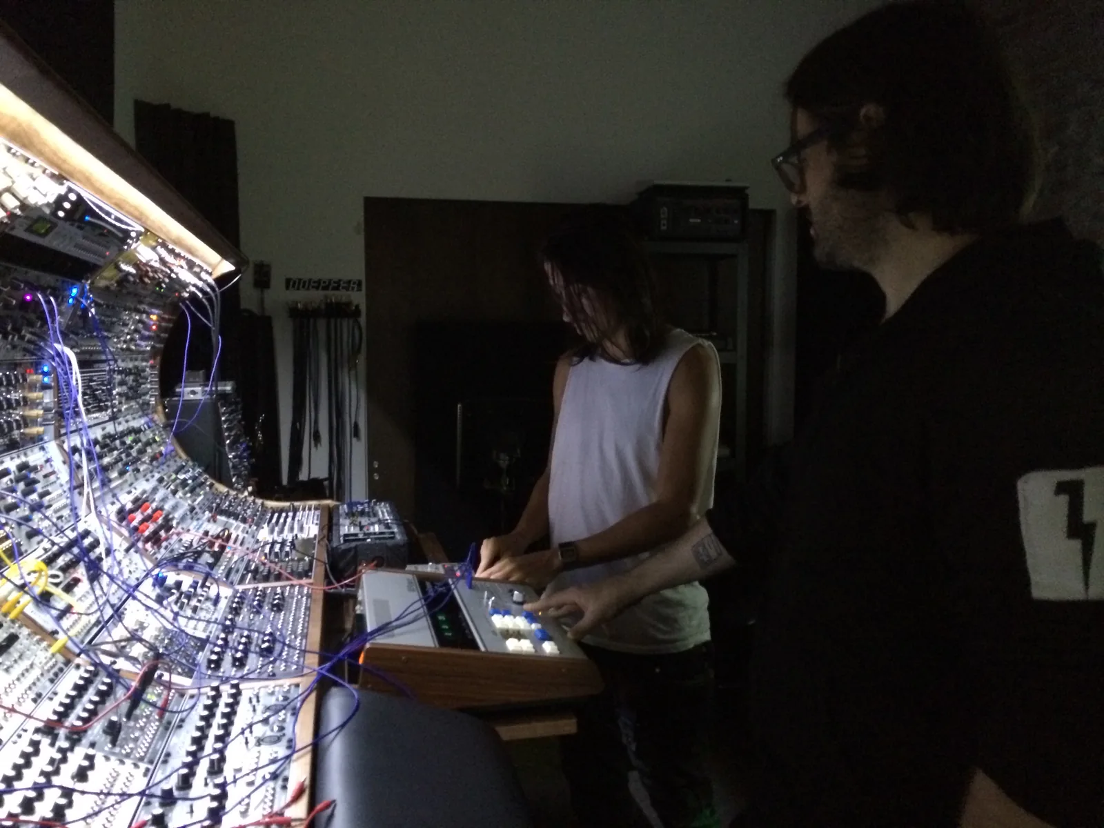 Baseck and Alessandro Cortini at the curved modular console, one of them at a small keyboard