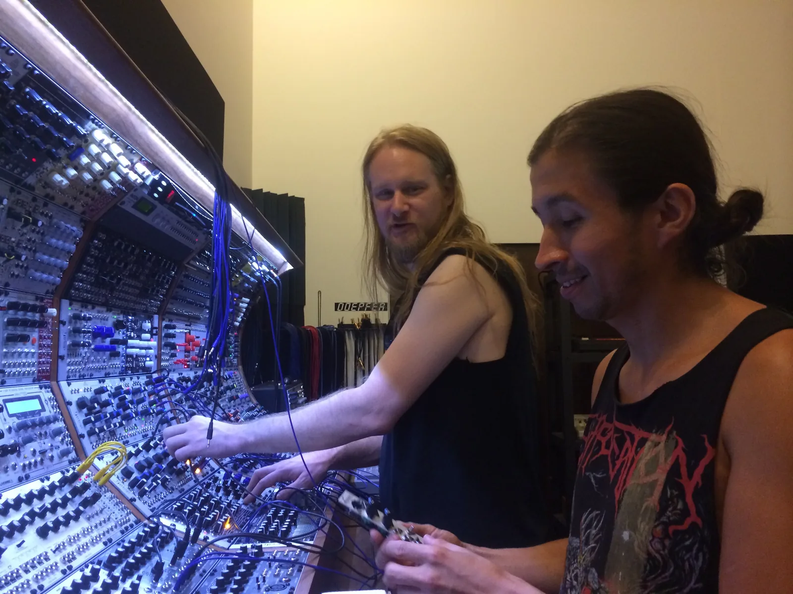 Venetian Snares and Baseck patching the big modular under its lights