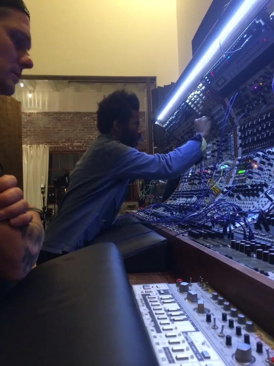 Rodent and Robert Aiki Aubrey Lowe (Lichens) at a modular system under a strip light