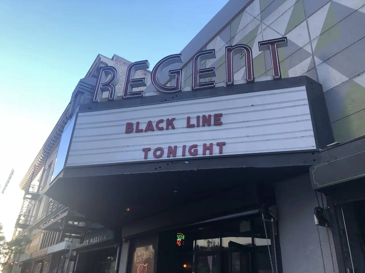 The Regent Theater marquee reading “Black Line tonight”