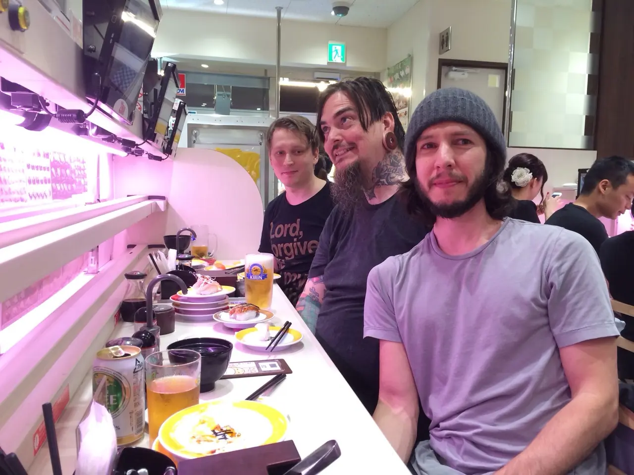 Roman of Black Corporation, Josh of Malekko and DarkPlace, and Cyrus at a restaurant counter in Tokyo