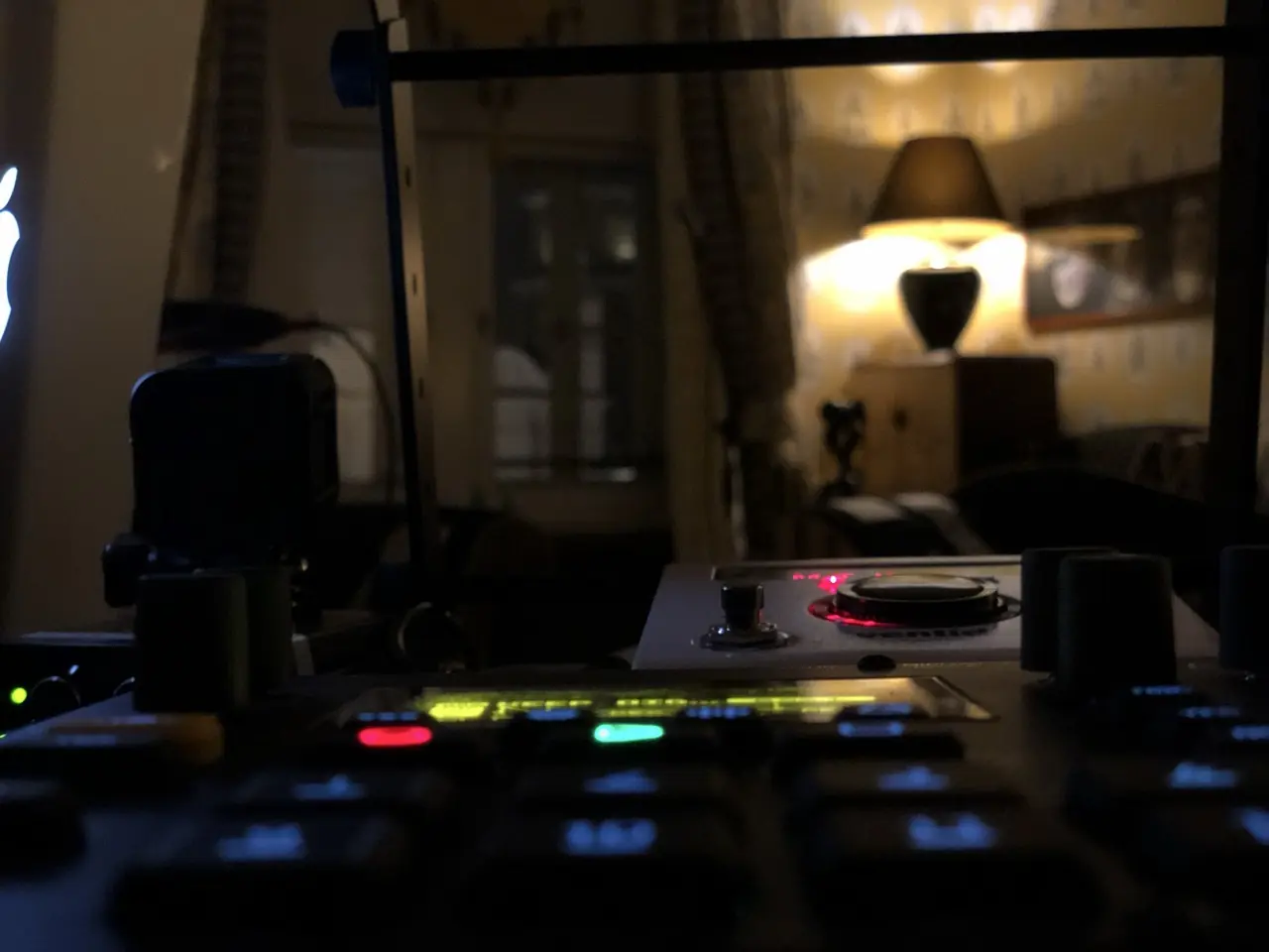 Black Line rehearsals at the hotel in Kraków: gear on a table in a dim, lamp-lit room